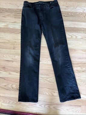 Calvin Klein Men's Straight Black Jeans with Subtle Fade